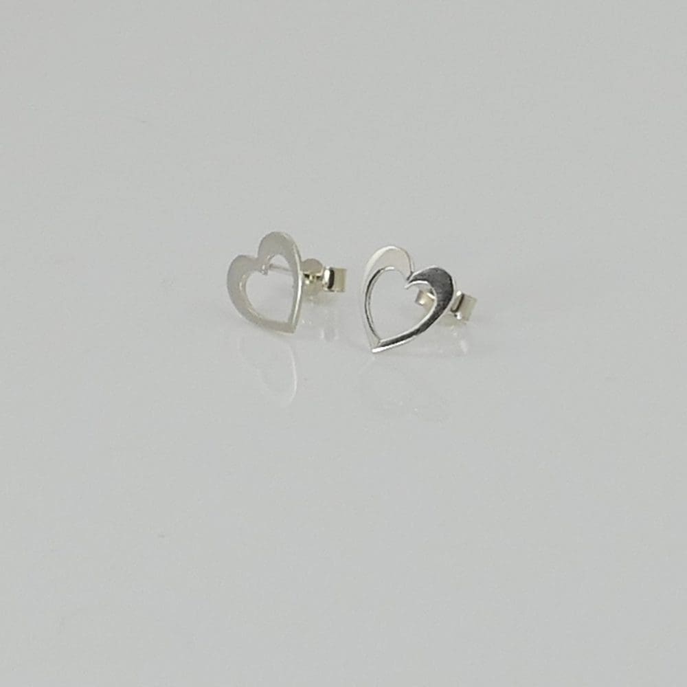recycled-sterling-silver-heart-in-heart-ear-studs-on-a-white-background