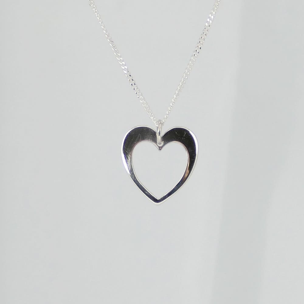 recycled-sterling-silver-heart-in-heart-pendant-and-chain-hanging-on-a-white-background