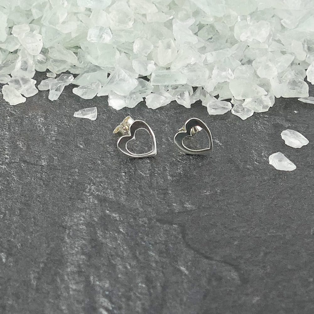 recycled-sterling-siver-heart-in-heart-ear-studs-on-a-grey-background