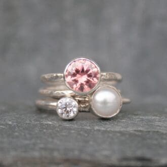Stacking rings created from cubic zirconias and a freshwater pearl.