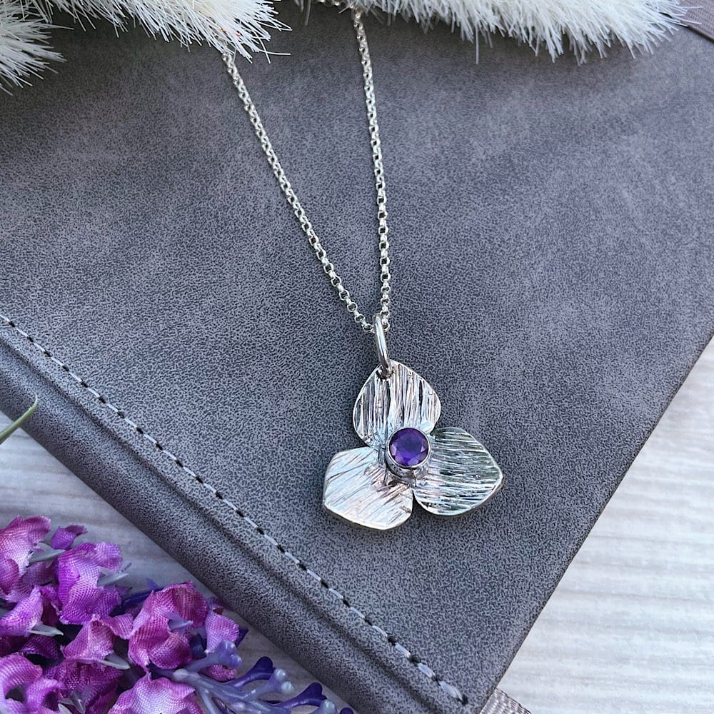 silver flower necklace with amethyst birthstone