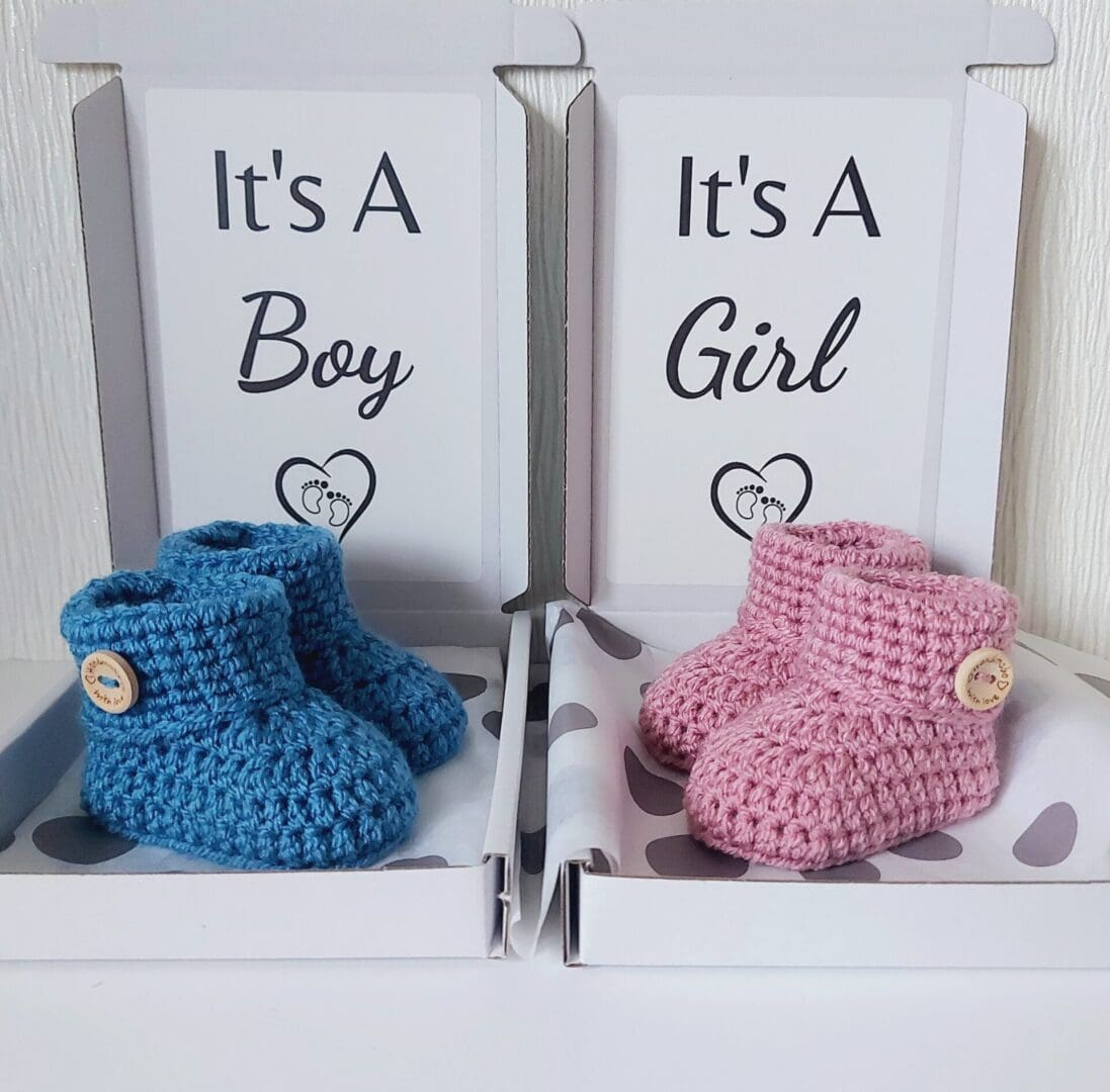 pregnancy Gender Reveal Announcement Idea, a pair of newborn handmade crochet baby booties in a box saying its a boy or its a girl, personalised text can also be chosen