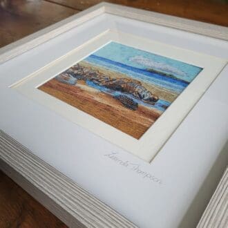 Square framed print of original embroidered art work. Embroidery of low tide at broad haven beach in Pembrokeshire. 33 x 33 cm square wooden frame.
