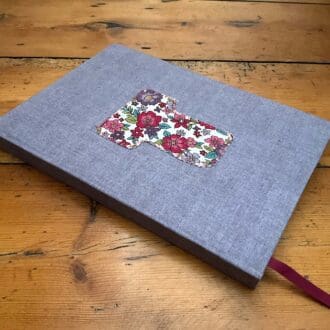 Fabric covered A5 handmade notebook with an initial T