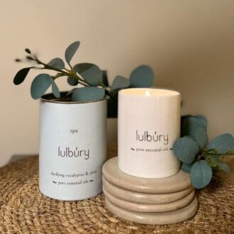 White travel candle with blue tube and eucalyptus