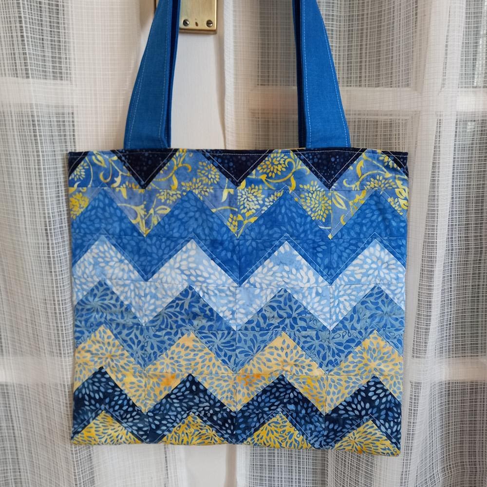Handmade batik fabric bag in yellow and blue