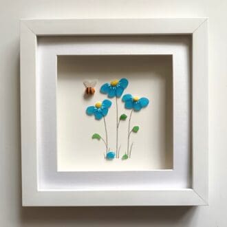 framed picture of forget me nots made from Cornish sea glass