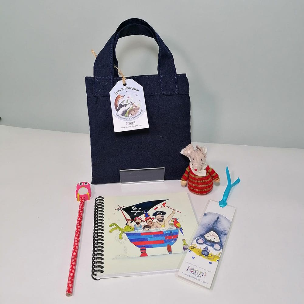 Mini book bag that holds the doodle kit stationery set, coil bound sketchbook, pencil with a character eraser topper and a mouse bookmark