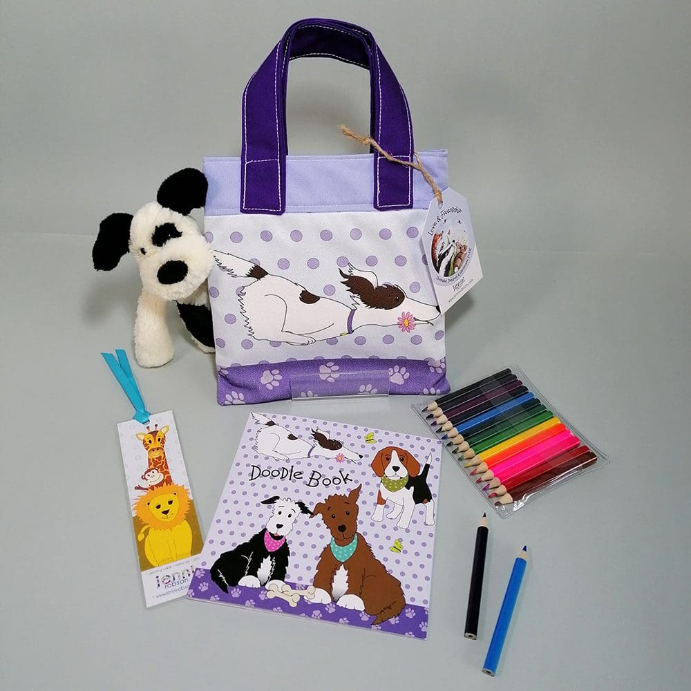 Running dog cotton mini bookbag filled with a sketchbook with furry animal covers, a jungle bookmark and 14 mini pencils