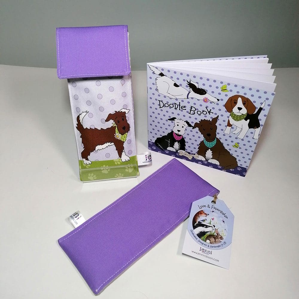 Dog in a bandana Doodle Kit, stationery set. Comprising of a lined handmade cotton pouch, 8 colouring pencils and a 20 page sketchbook.