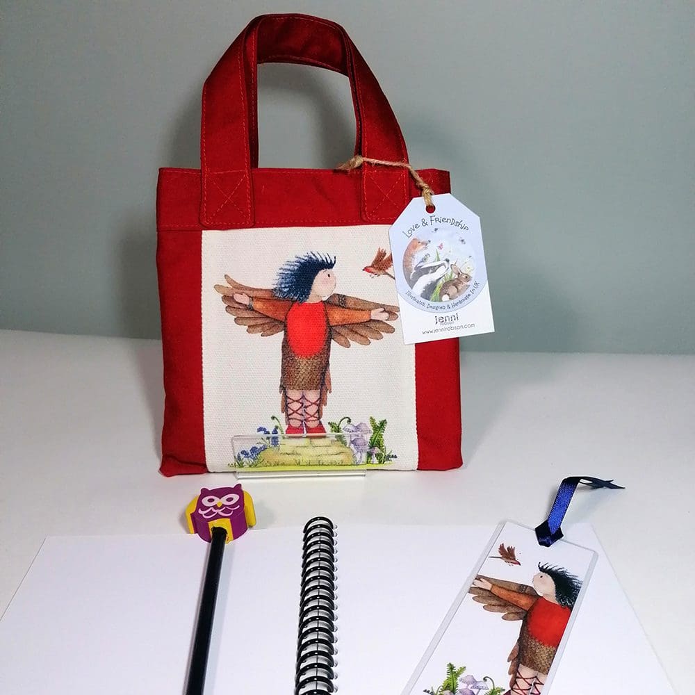 Little red cotton handbag water resistant lining featuring Micheala and Robbie Robin illustration. The bag contains a coil bound sketchbook featuring pirates in a bathtub, a pencil with an eraser character topper and a laminated bookmark printed with Michaela and her bird friend. Ideal for kids who love to draw.