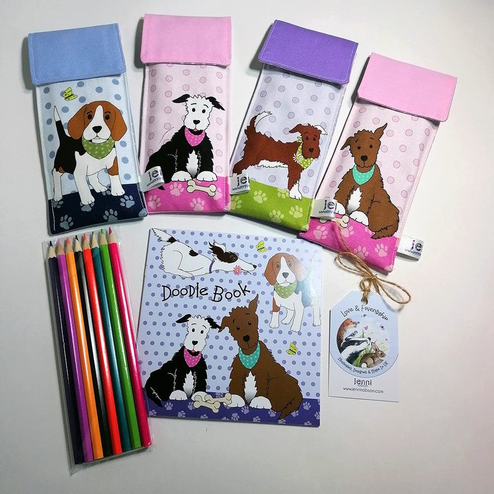 Full range of Dog Doodle Kit, stationery sets. Comprising of a lined handmade cotton pouch, 8 colouring pencils and a 20 page sketchbook.