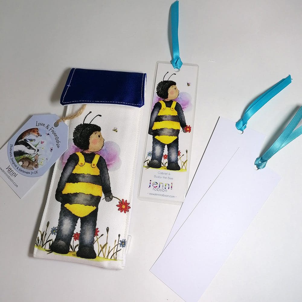 Handmade cotton pouch containing 8 colouring pencils, a laminated, printed bookmark and two blank bookmarks ready to be coloured with satin ribbon decoration. Set features Gabriel and Buzby bee