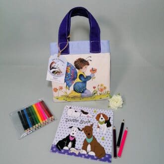 Sweet dark purple and pale blue cotton handbag water resistant lining featuring Casper butterfly and Frank Caterpillar illustration. The bag contains a stapled blank 20 page sketchbook featuring a selection of dogs and furry friends, 14 mini colouring pencils with a laminated bookmark printed with Casper and caterpillar friend. Ideal for kids who love to draw.