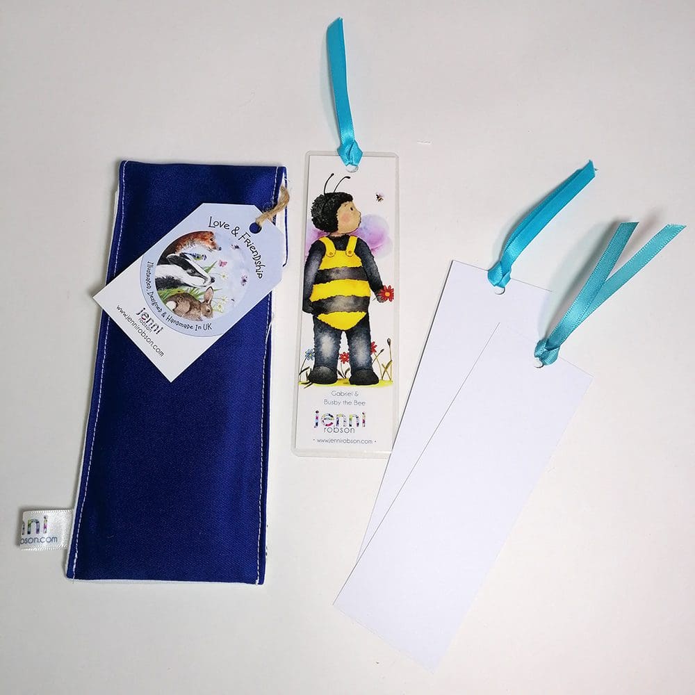 Handmade cotton pouch containing 8 colouring pencils, a laminated, printed bookmark and two blank bookmarks ready to be coloured with satin ribbon decoration. Set features Gabriel and Buzby bee