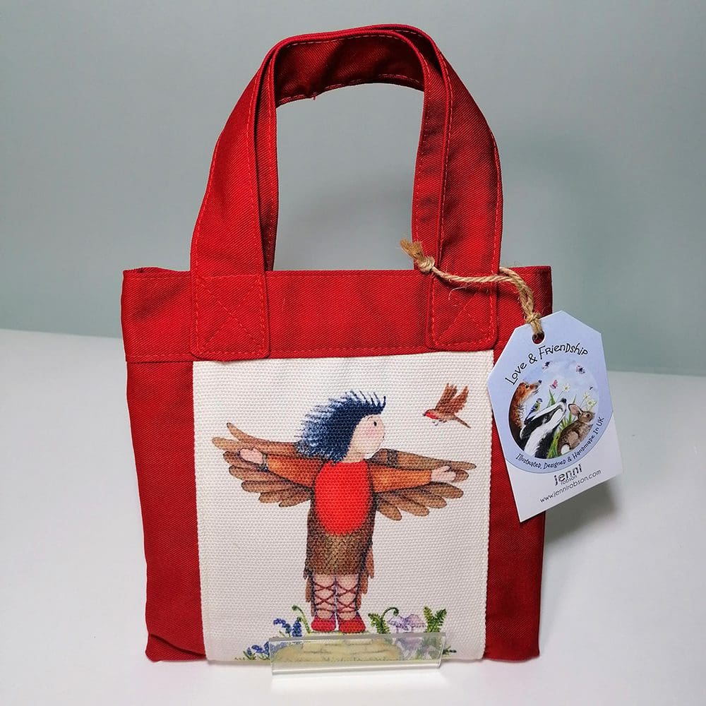 Little red cotton handbag water resistant lining featuring Micheala and Robbie Robin illustration. The bag contains a coil bound sketchbook featuring pirates in a bathtub, a pencil with an eraser character topper and a laminated bookmark printed with Michaela and her bird friend. Ideal for kids who love to draw.