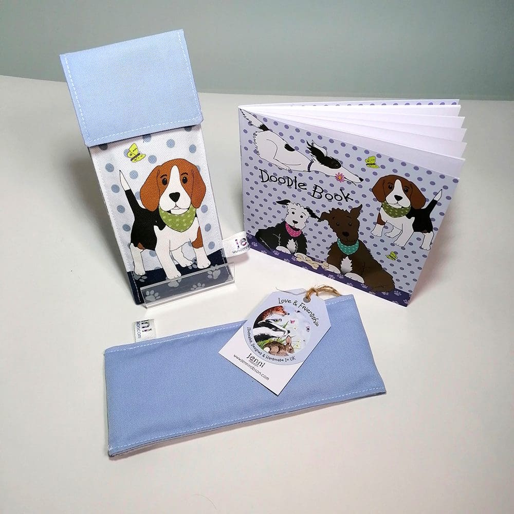 Beagle Doodle Kit, stationery set. Comprising of a lined handmade cotton pouch featuring a Beagle dog on the front and pale blue back, 8 colouring pencils and a 20 page sketchbook.