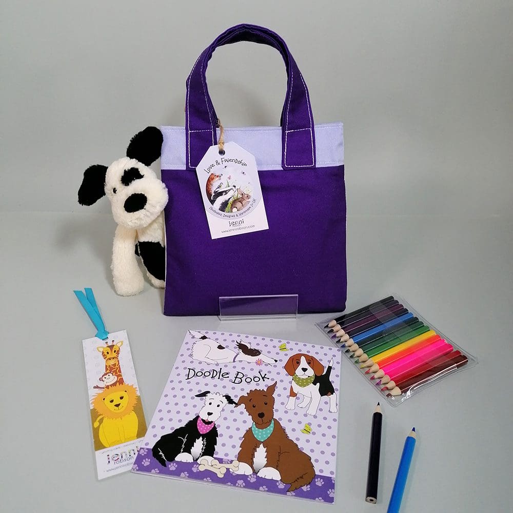 Running dog cotton mini bookbag filled with a sketchbook with furry animal covers, a jungle bookmark and 14 mini pencils