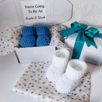 pregnancy Reveal Announcement Gift Idea for auntie and uncle, a pair of newborn baby booties wrapped with a gift message to surprise the recipients