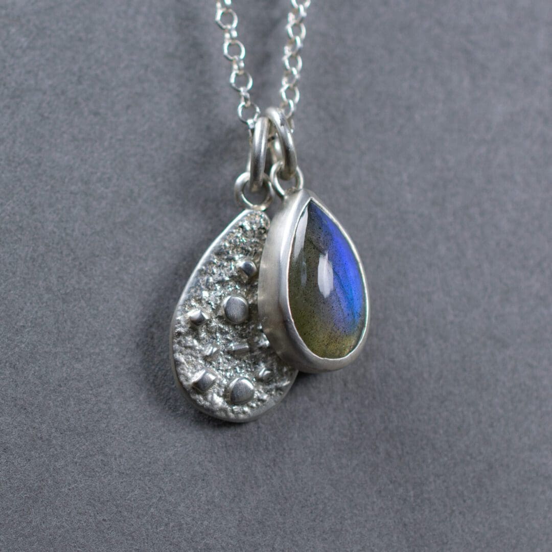 Argentium Silver Necklace with natural teardrop shaped Labradorite gemstone. Textured Sterling Silver charm.
