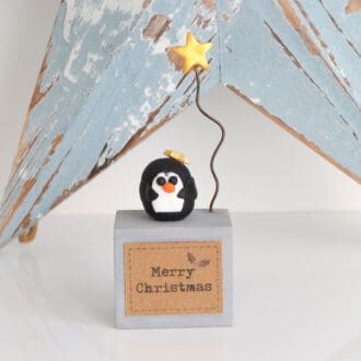 Polymer clay penguin with single Christmas star festive decoration