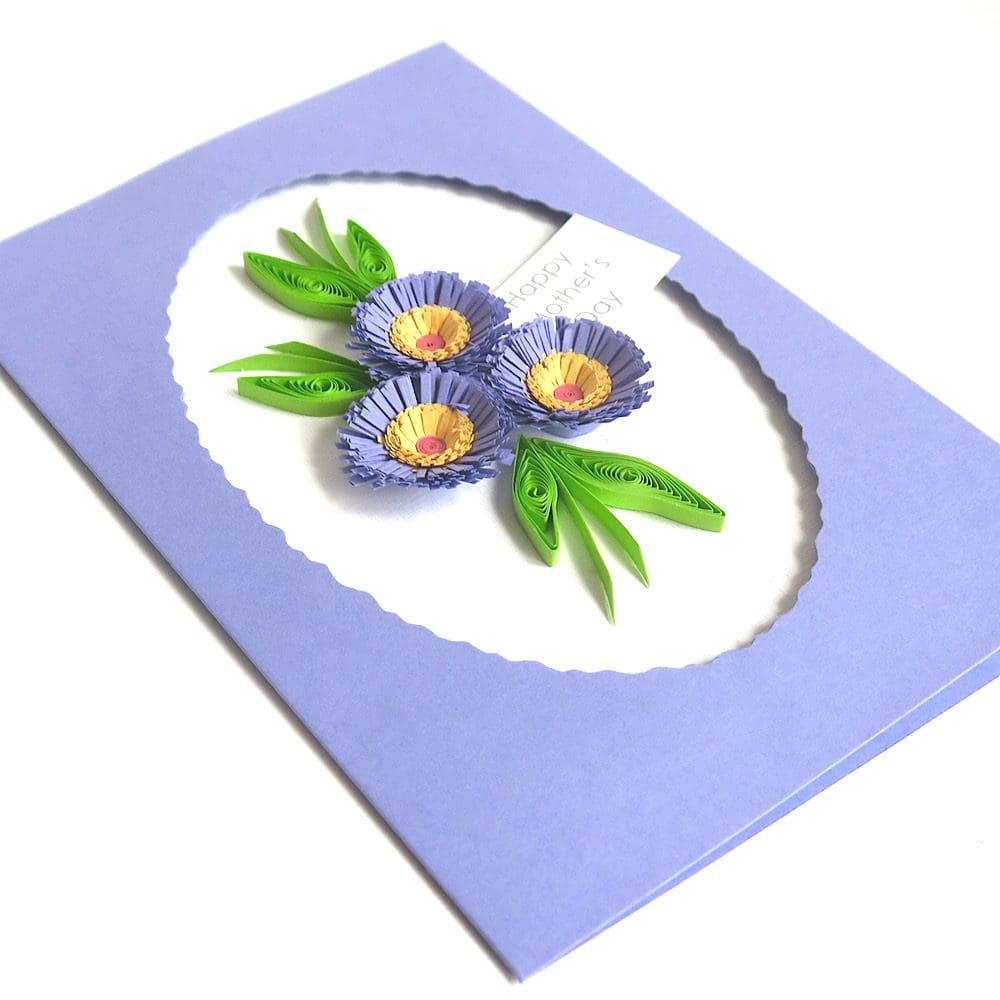 Handmade Mother's Day card with a trio of quilled flowers in lilac with an oval frame.