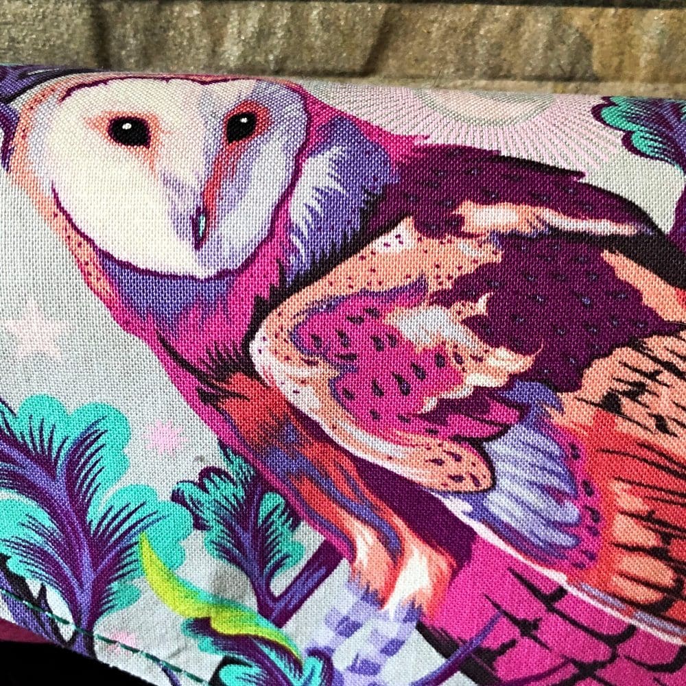 Ladies clutch wallet showing a close up of featured Tula Pink Owl print flap