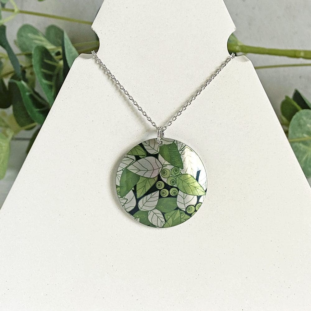Pendant artistic, olive green leaves, handmade jewellery, aluminium, metal, round, disc, circle, medallion