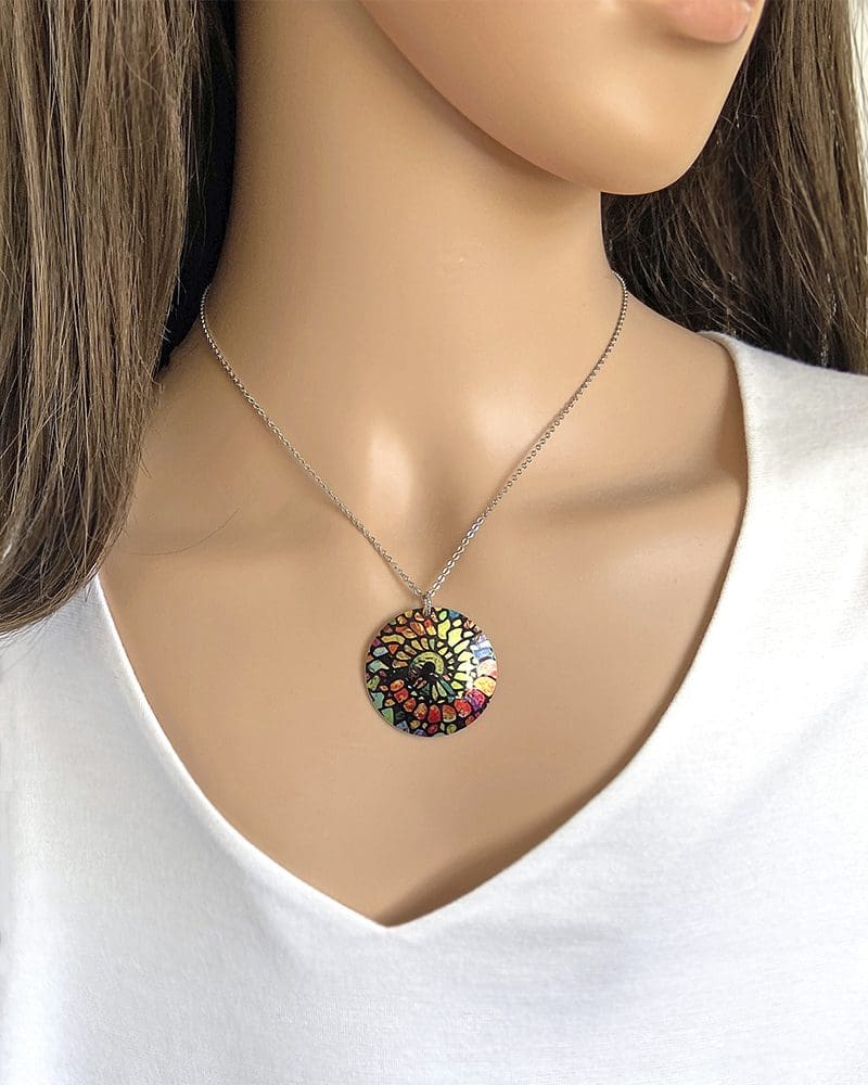 spiral, ammonite, green, orange, pendant, necklace, aluminium, jewellery, artistic, unique, unusual, handmade UK. Decumi designs