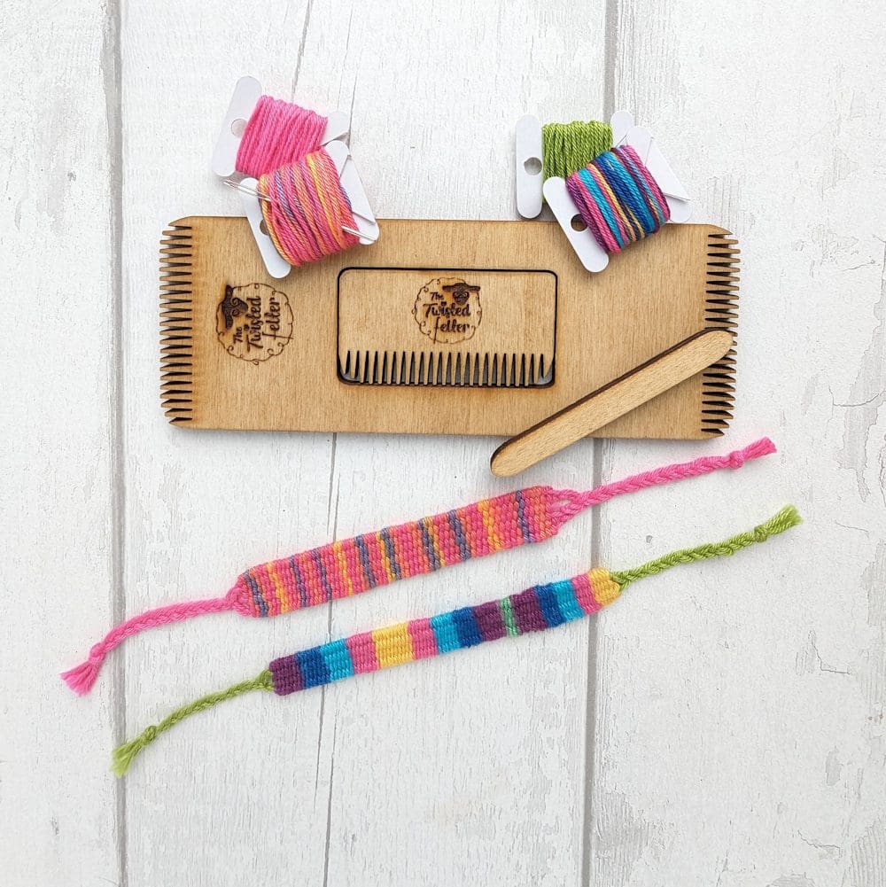 mini weaving loom with coloured thread on bobbins