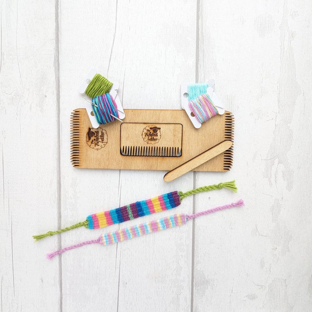 mini weaving loom with coloured threads and woven bracelets