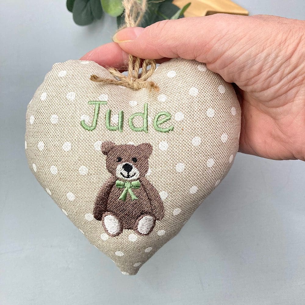 Personalised teddy bear heart held in hand