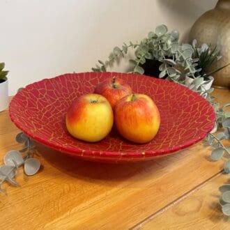 red glass crackle fruit bowl with apples