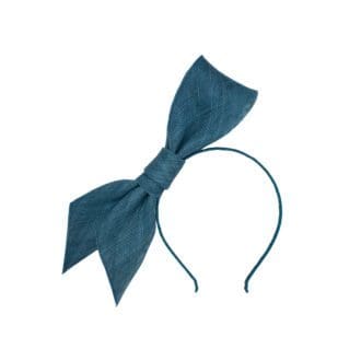 large bow on a headband in teal blue