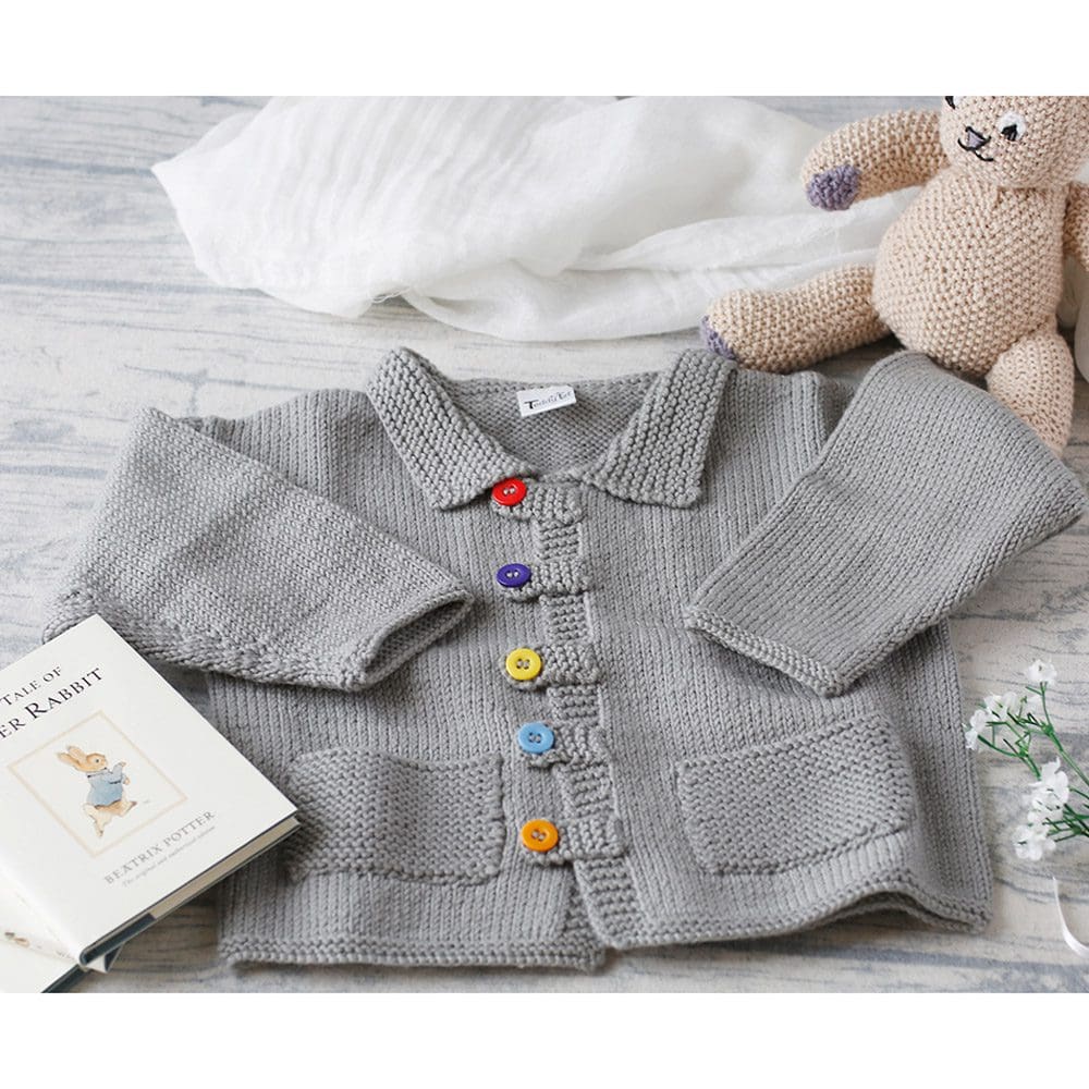 toddler's handmade knitted jacket in grey with coloured buttons