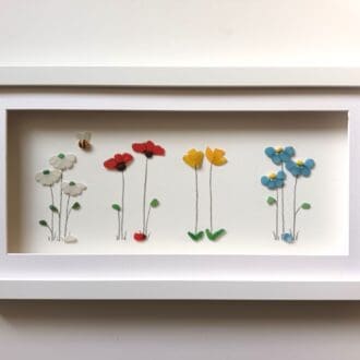 sea glass spring flowers in long frame forget me nots, daisies, daffodils and poppies