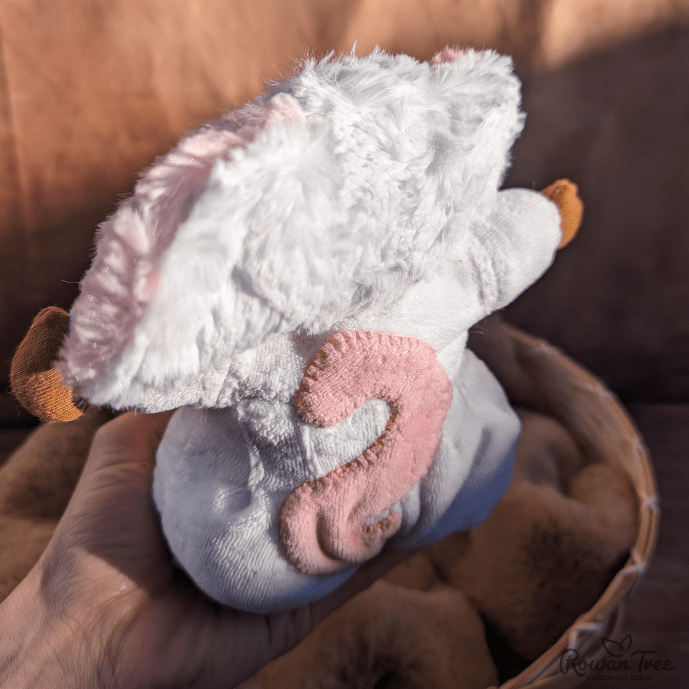 little mouse doll from the back showing appliqué tail with blanket stitch edging