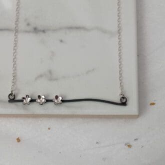 oxidised sterling silver wire and flower necklace
