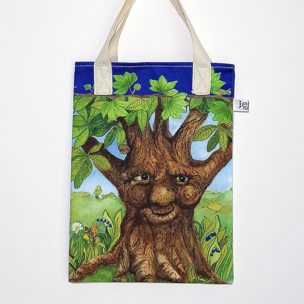 Wildlife bookbag featuring Charlie Chestnut tree on the bag front. Blue trim on top edge with chestnut tree branch decoration and pale cream cotton handles.