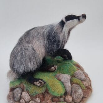 Needle Felted Badger Sculpture on felted mossy foam base by Davina Brien - Two Little Hares Designs.