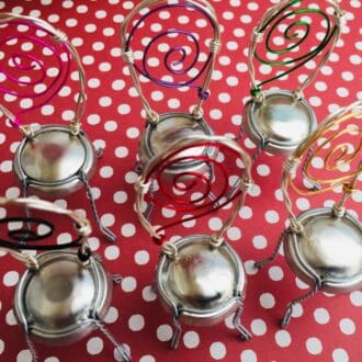 Six chair place settings made from wine bottle metal cages