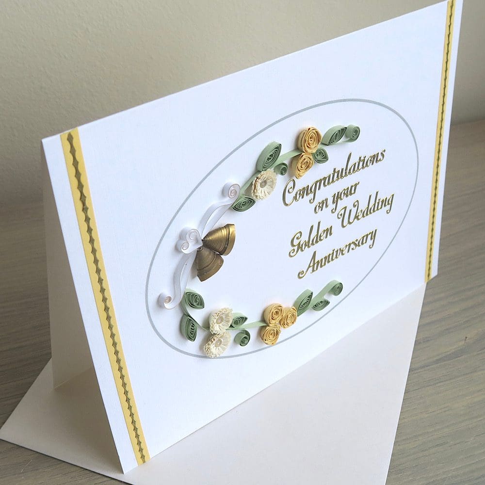 Handmade olden wedding card with quilled flowers and bells