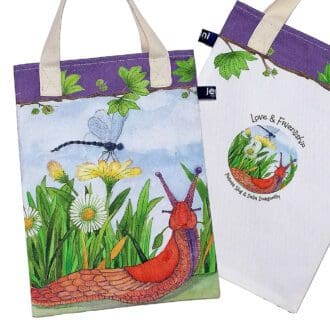 Wildlife bookbag featuring a dragonfly and slug amongst the grass and daisies on the front. Purple trim on top edge with chestnut tree branch decoration and pale cream cotton handles.