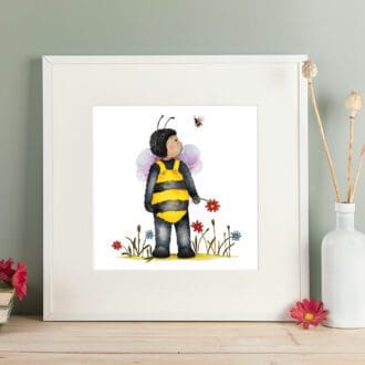 Print of a a young boy dressed as his bee friend, stood amongst the flowers. Giclee print with a white mount. Shown in a readily available standard size square white frame