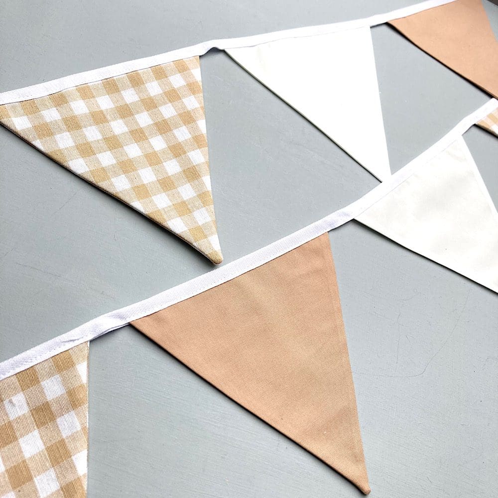 Beige Gingham Bunting hung on wall