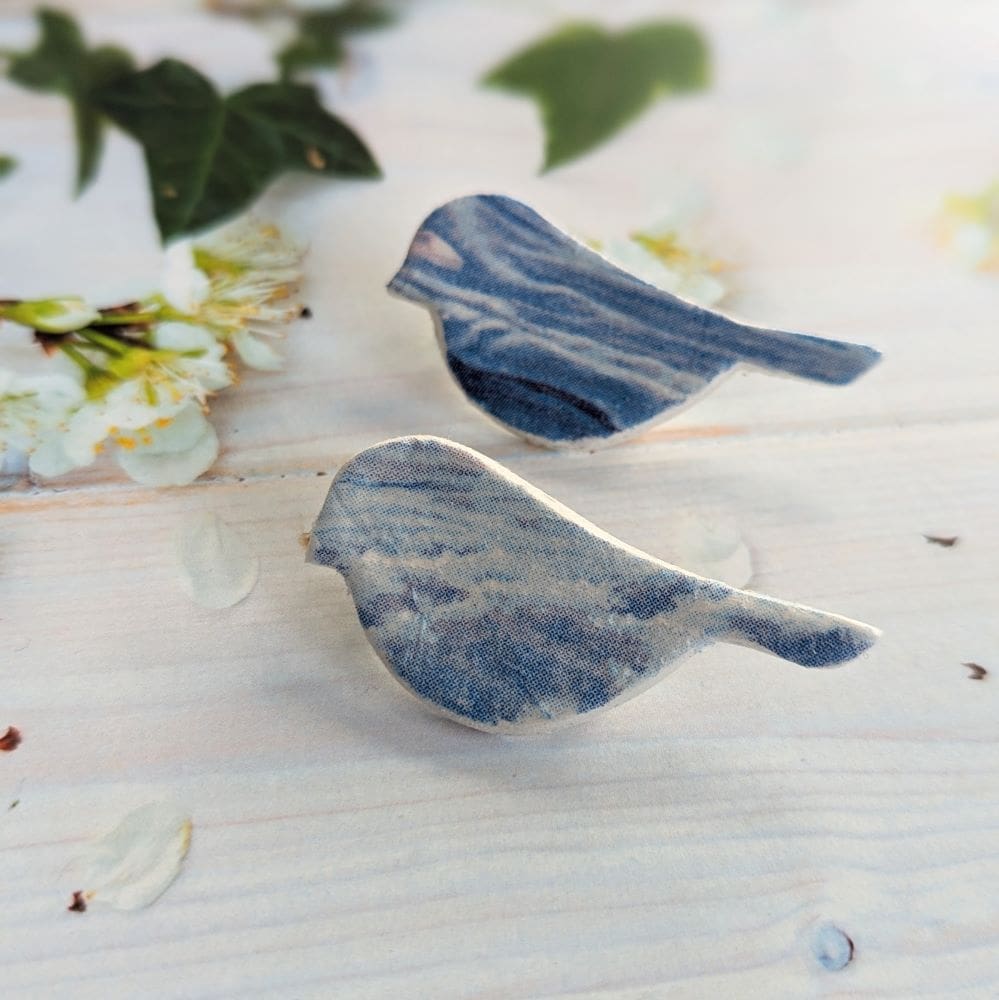 Small clay bird brooch decoupaged with a blue design