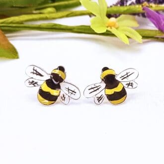 Cute bee stud earrings. Colourful resin bees with a sterling silver stud fitting.