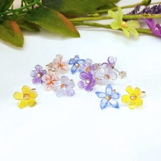 Delicately coloured flower blossom earrings with sterling silver stud fitting.