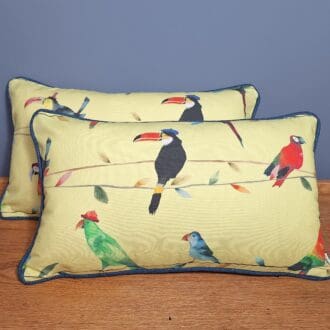 Pair of landscape cushions in Toucan Talk from Prestigious Textiles