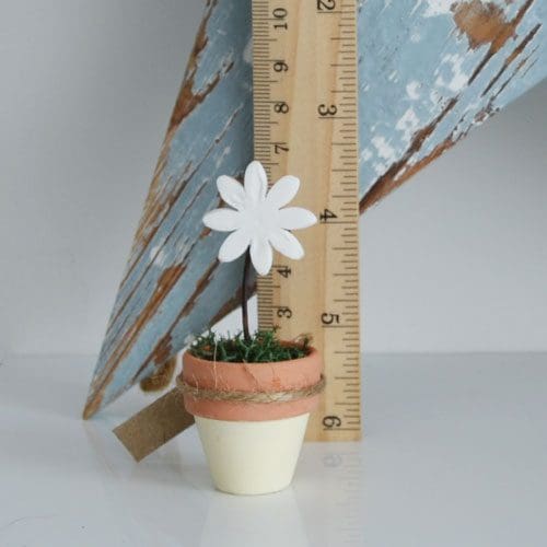 Little clay daisy in a terracotta pot, a gift for Mum